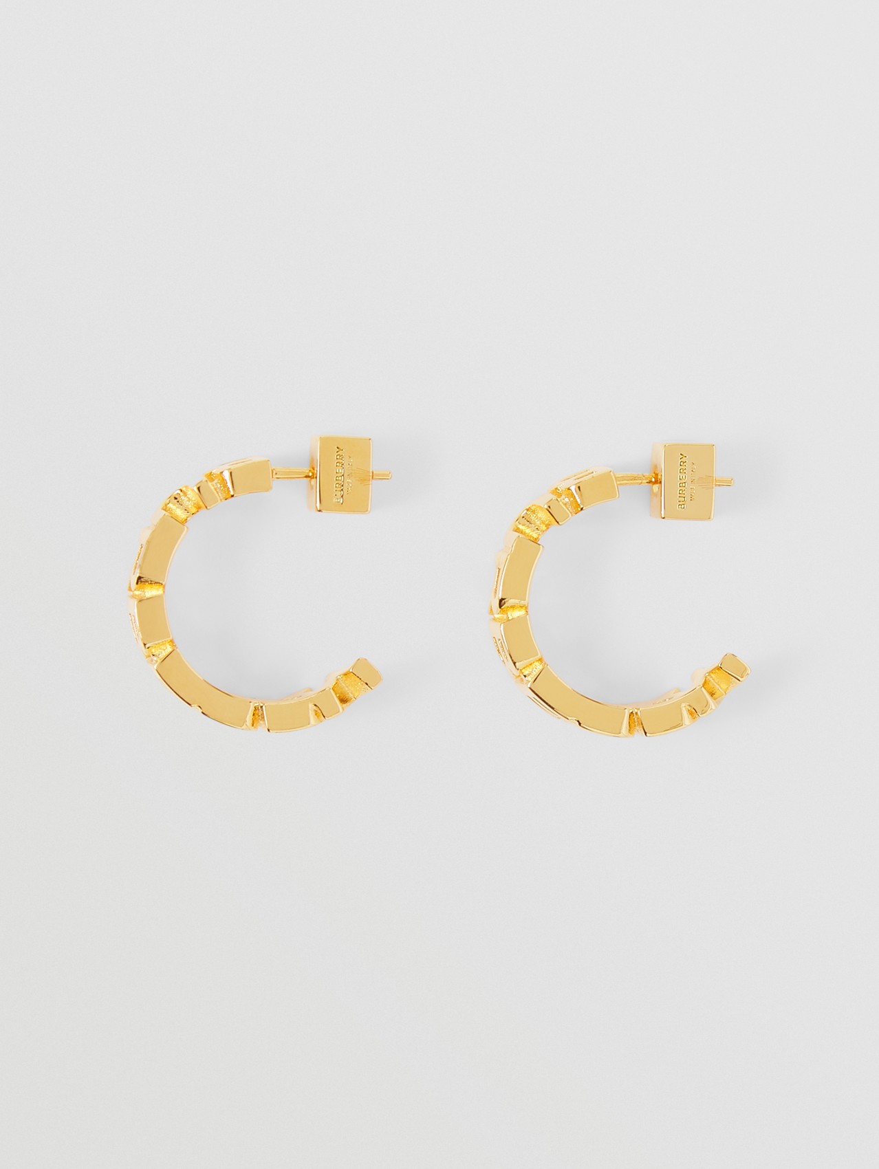 Pendientes de aro chapados en oro con forma de logotipo (Dorado Claro)