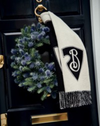 Black door with Burberry wreath and Burberry Cashmere Scarf. 