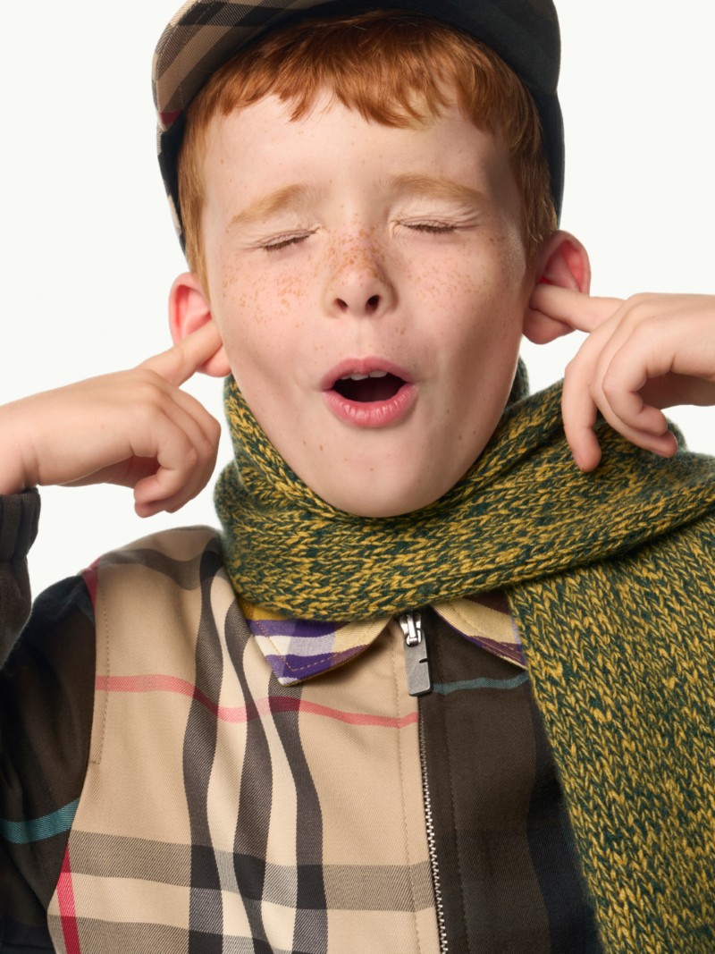 Shot of Boy model wearing Contrast Check Cotton Harrington Jacket in colour Dusk