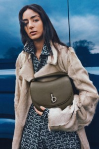 Nora Attal holding Rocking Horse Bag in colour Military 