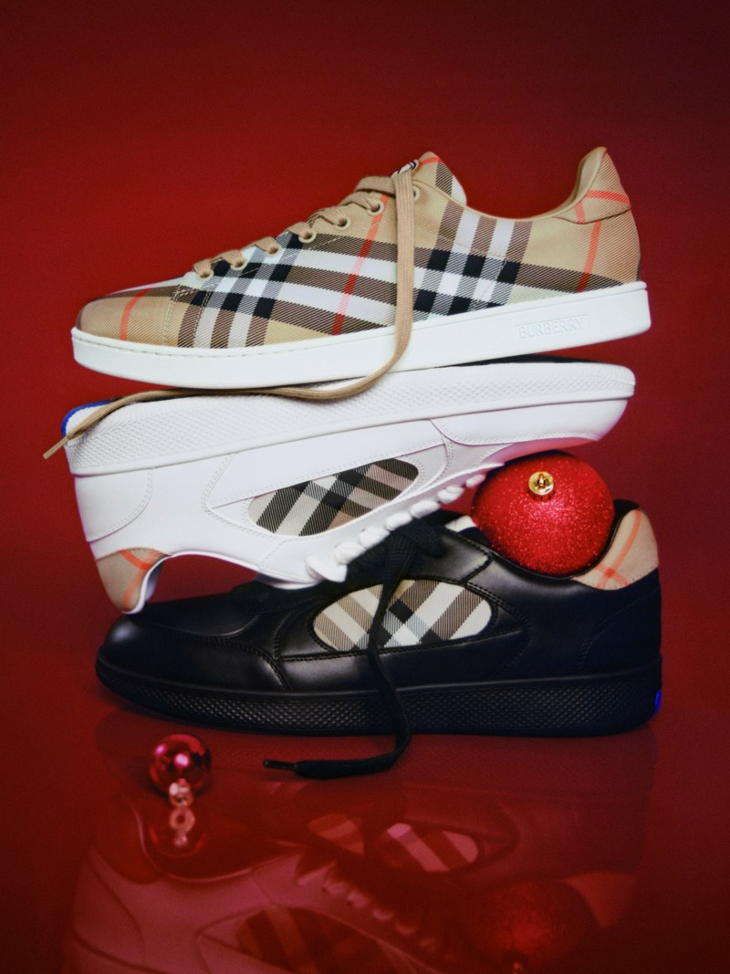 Burberry Festive Campaign featuring Burberry Terrace and Check and Leather Sneakers on a Festive red background with decorations. 