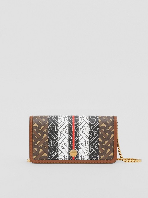 Click to view more detailed imagery on our partner's website Burberry Monogram Stripe E-Canvas Phone Wallet With Strap In Brown Multi
