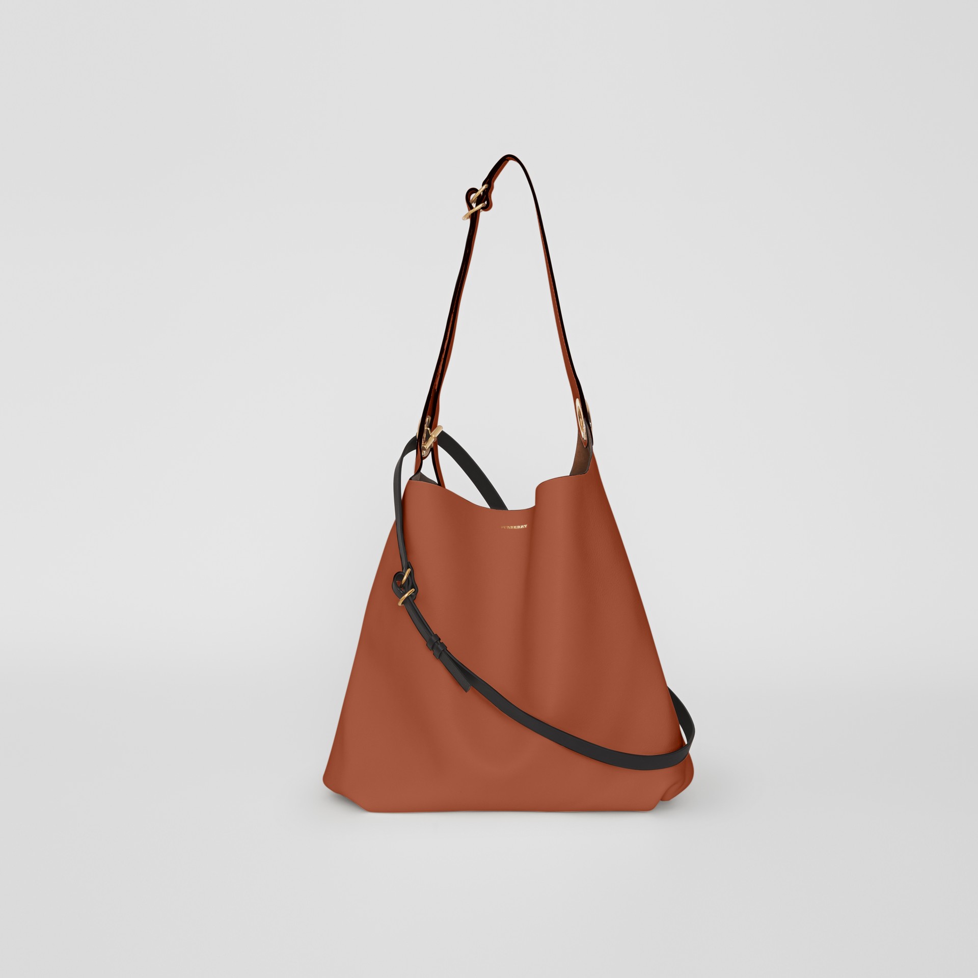 grommet detail strap bag