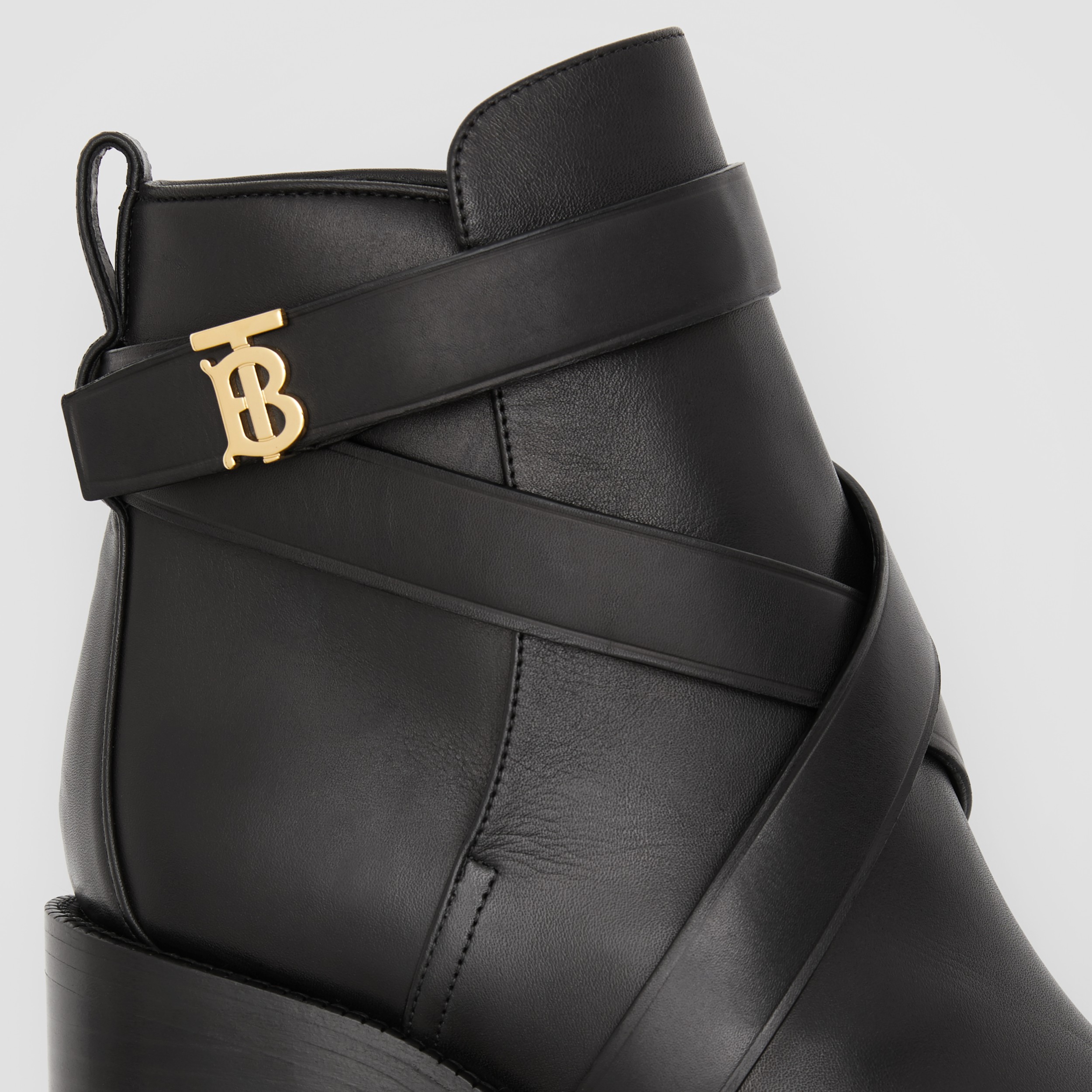 monogram buckle cleat ankle boots