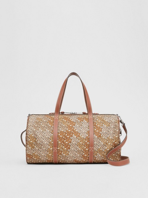 Click to view more detailed imagery on our partner's website Burberry Monogram Print Nylon And Leather Barrel Bag In Camo Brown